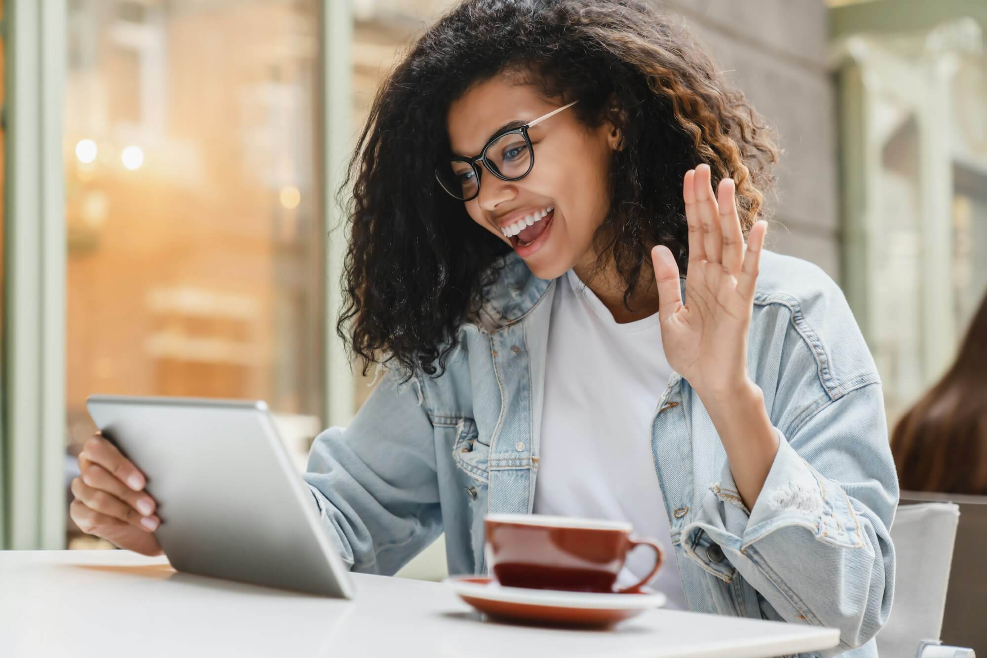 Young african-american female student freelancer businesswoman talking on video call