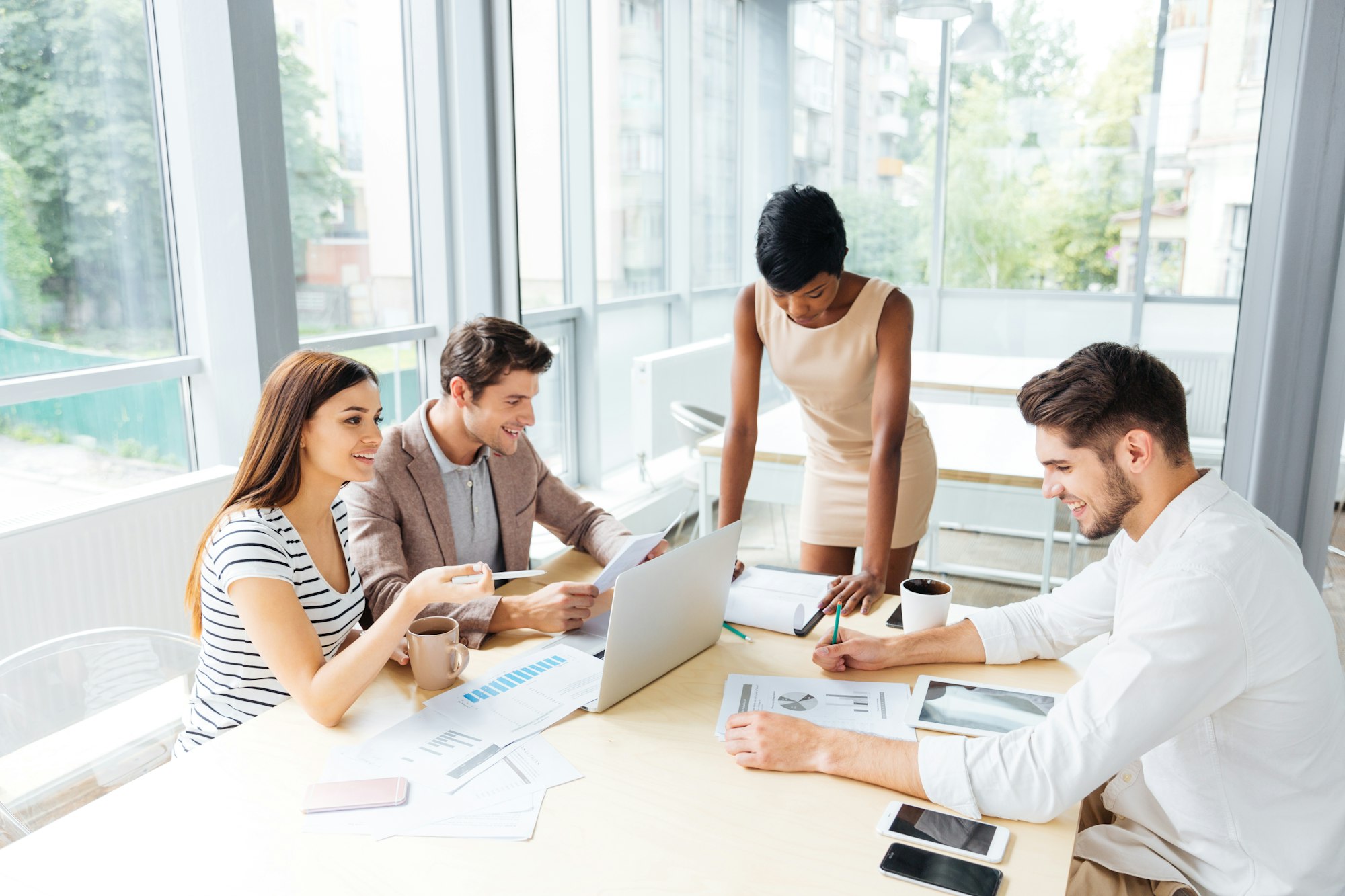 Business people discussing financial report and new project in office