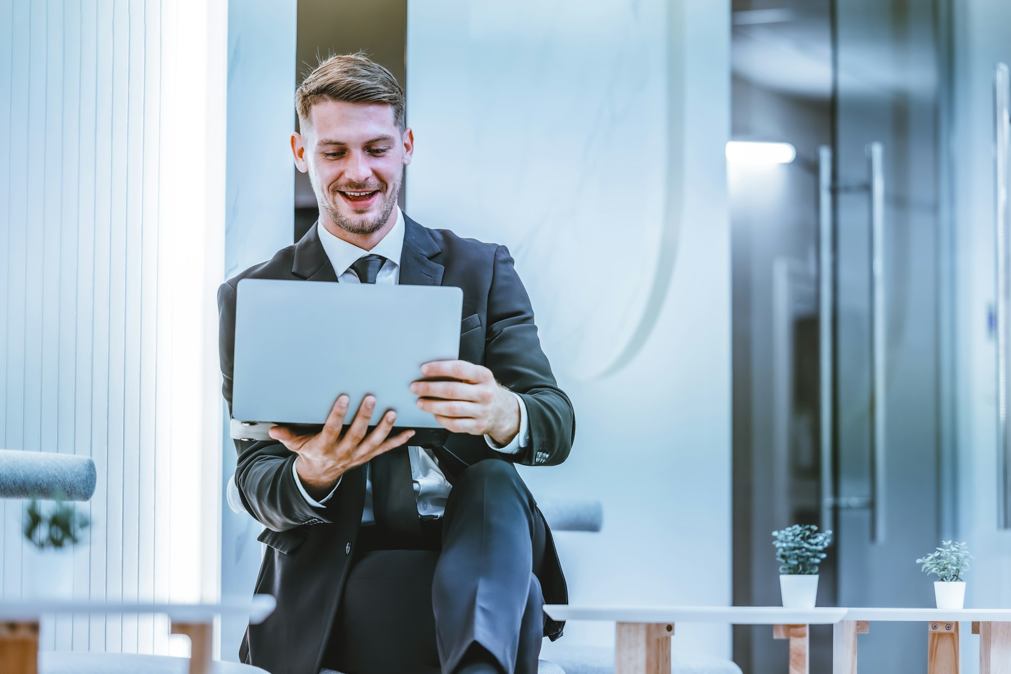 Confident man leads, showcasing leadership, strategic thinking, overseeing operations with laptop