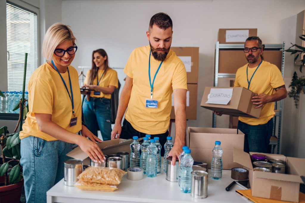 Group of volunteers working in community charity donation center