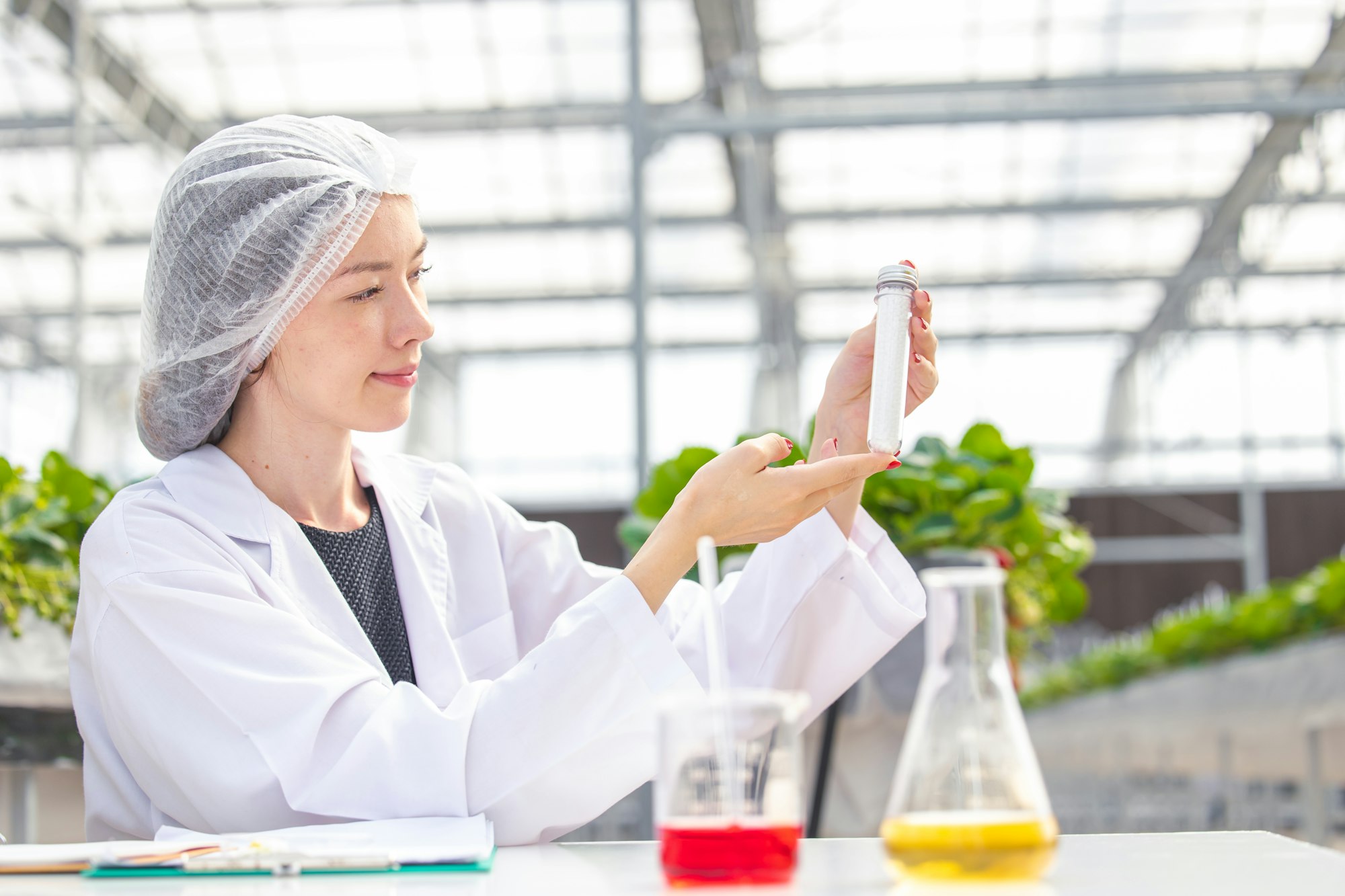 scientist working in organic agriculture farm research new chemical formula extract from plant