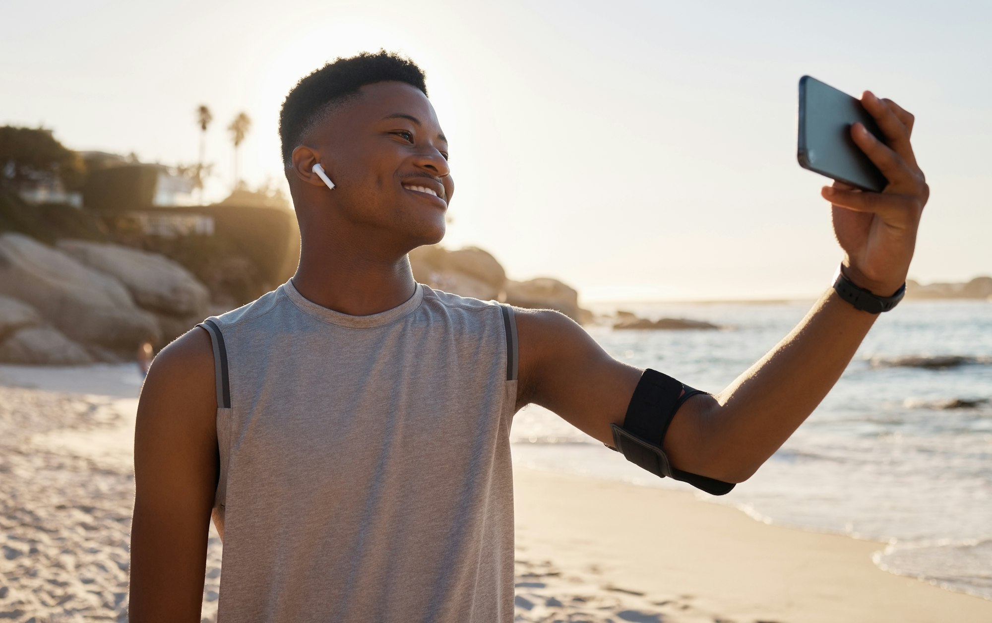 Sports, fitness selfie and black man at beach for social media, video call or training blog update